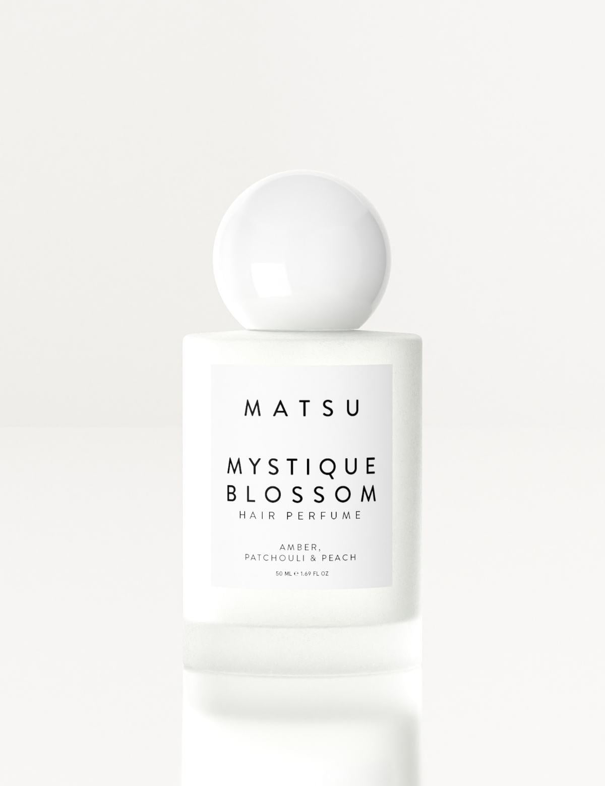 mystique-blossom-sac-parfumu-50-ml-beyaz-cicekler-odunsu-notalar-hair-mist-807.jpg